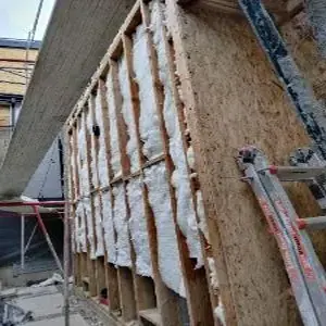 Exposed wall framing during Faircrest Heights water damage reconstruction